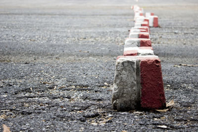 Close-up of stones on road in city