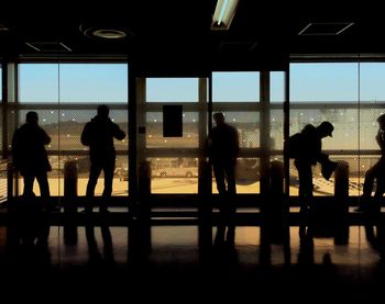 Silhouette of people at airport