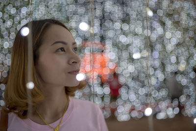 Portrait of young woman looking away