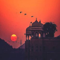 Silhouette of building at sunset