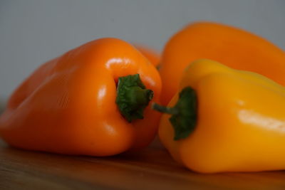 Close-up of orange bell peppers on cutting board