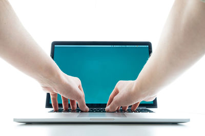 Man using laptop on table