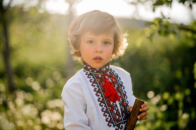 Portrait of cute girl standing outdoors