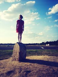Woman standing on grass