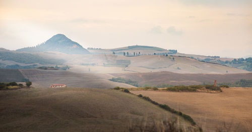 Scenic view of landscape and mountains against sky