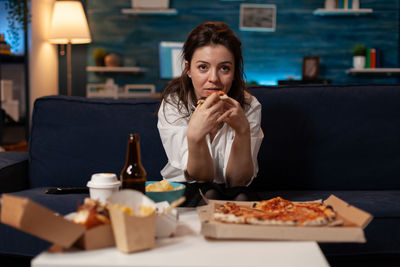 Young woman drinking glass