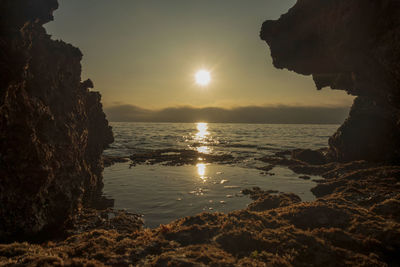 Scenic view of sea against sky during sunset