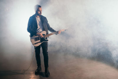 Young man playing guitar