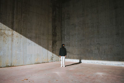 Rear view of woman walking in building