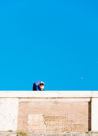 Low angle view of building against clear blue sky
