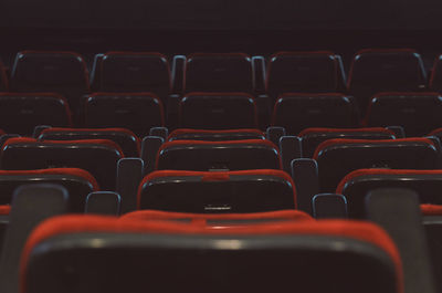 Full frame shot of empty red seats in movie theater