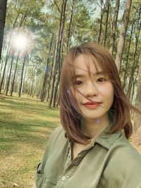 Portrait of young woman in forest