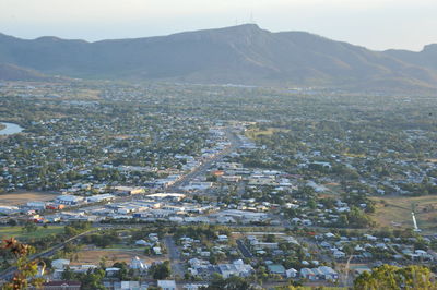 High angle view of townscape and mountains against sky