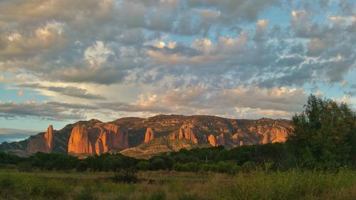 Scenic view of landscape against cloudy sky