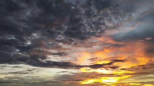 Low angle view of dramatic sky during sunset