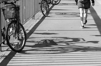 Low section of people riding bicycle on street