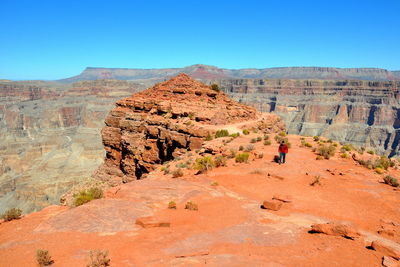 Rock formations on landscape against sky
