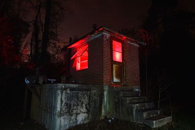 Low angle view of built structure at night