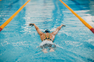 Woman swimming in pool