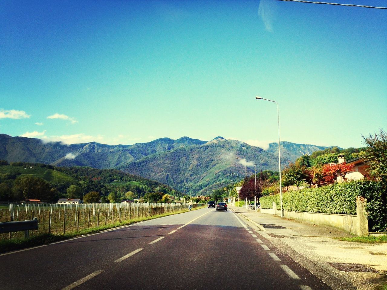 mountain, road, the way forward, transportation, blue, mountain range, road marking, clear sky, country road, diminishing perspective, sky, copy space, landscape, vanishing point, street, empty, tranquility, nature, scenics, tranquil scene