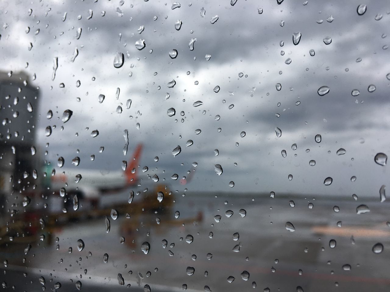 RAINDROPS ON GLASS WINDOW