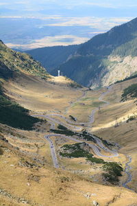 High angle view of land and mountains against sky