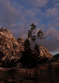 Low angle view of rock formation against sky