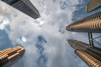 Directly below shot of buildings against sky