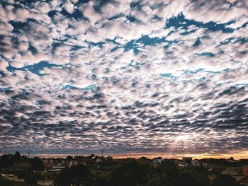 Scenic view of dramatic sky over city