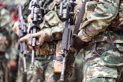 Soldiers with weapons on military combat training