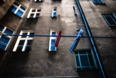 Low angle view of clothes line with pegs