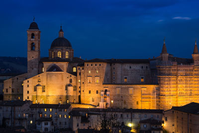 Illuminated buildings in city at night