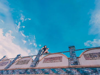 Low angle view of building against blue sky