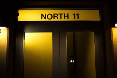 Illuminated text on yellow at night