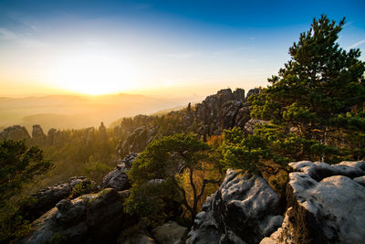 Scenic view of rocky mountains against sky during sunset