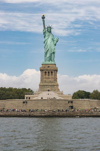 Low angle view of statue against sky