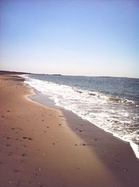 Scenic view of beach against clear sky