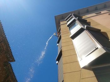 Low angle view of building against blue sky