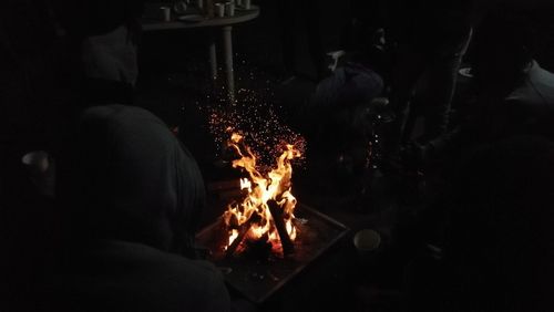 Man with fire crackers at night