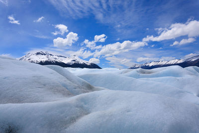 Scenic view of snowcapped landscape against sky