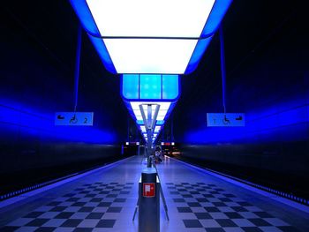 Empty illuminated underground walkway