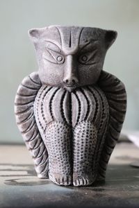 Close-up of statue against black background