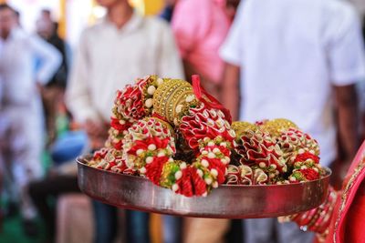 Close-up of holding artificial garland