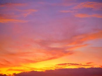 Low angle view of dramatic sky during sunset