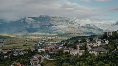 Aerial view of townscape against sky