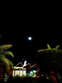 Illuminated built structure against clear sky at night