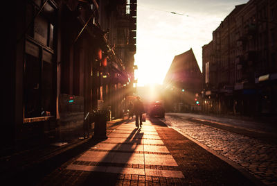 People in city against sky