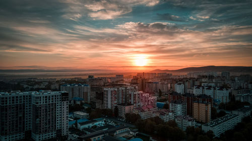 High angle view of buildings against sky during sunset