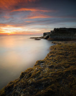 Scenic view of sea against sky during sunset