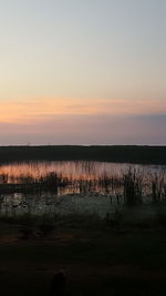Scenic view of calm sea at dusk